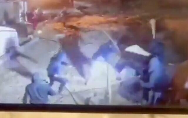 Settlers repeatedly bludgen a Palestinian in the village of Khirbet al-Fakhit in the southern West Bank on January 28, 2026. (Screen capture/X)